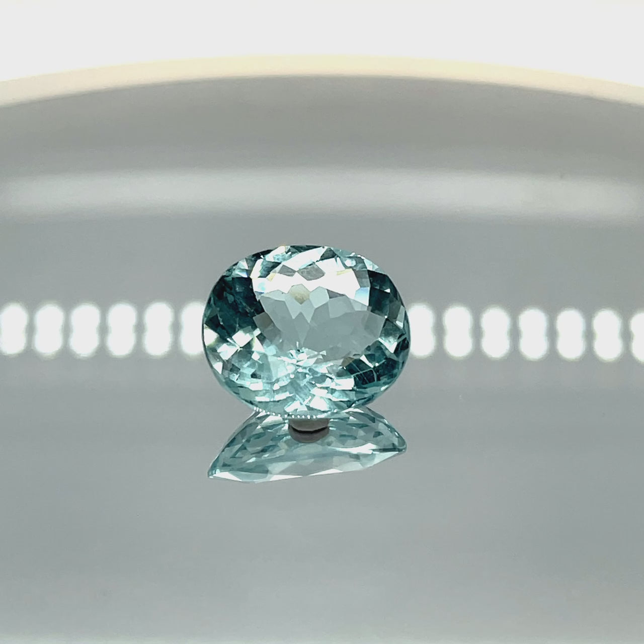 Natural aquamarine, 10.09 carats, roundish oval cut, untreated, vivid blue