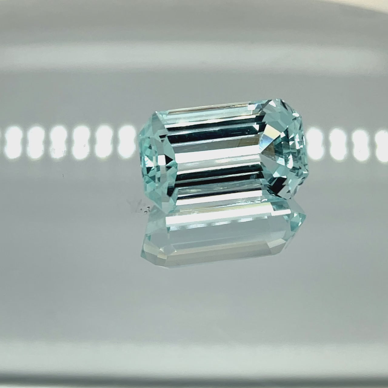 Natural aquamarine, 19.59 carats, emerald cut, eye clean clarity, untreated, very light slightly greenish blue
