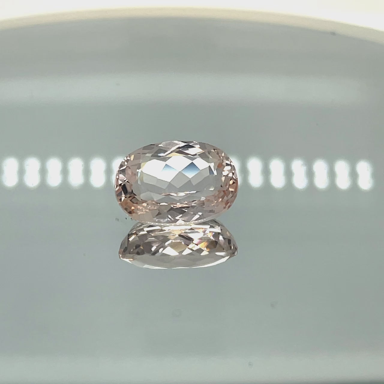 Natural morganite, 10.81 carats, oval cut, VVS–IF clarity, unheated, light pinkish-peach color