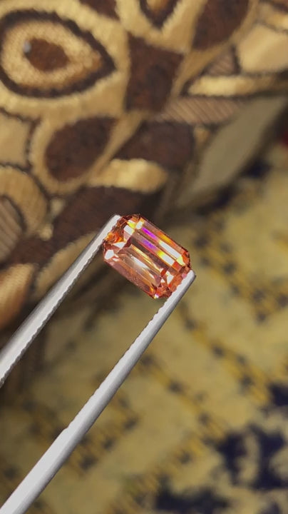 Natural zircon, 3.20 carats, emerald cut, VVS clarity, untreated, vivid orange-golden color