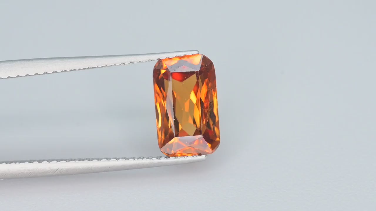 Natural whiskey honey brown zircon, 3.25 carats, rectangular step cut, VVS clarity, untreated, golden-brown hue