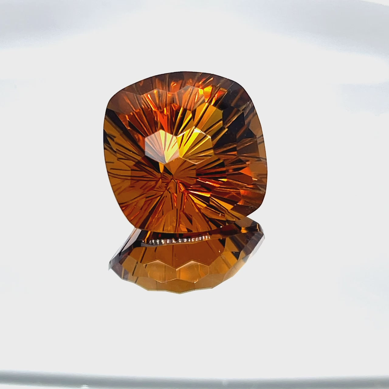 Natural honey citrine, 26.81 carats, cushion honeycomb cut, IF clarity, untreated, honey-orange color