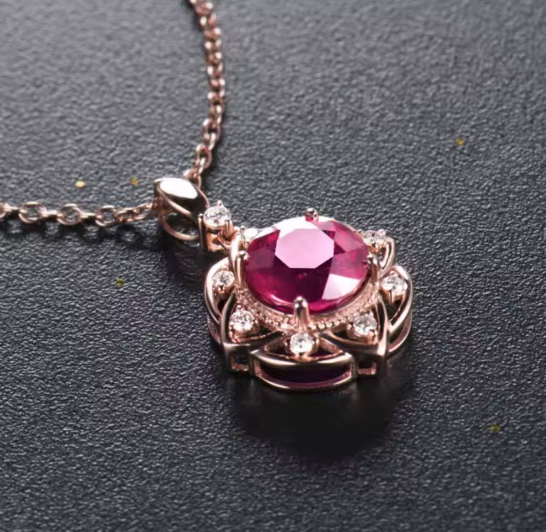 14K rose gold ruby diamond pendant with round natural ruby and floral halo design