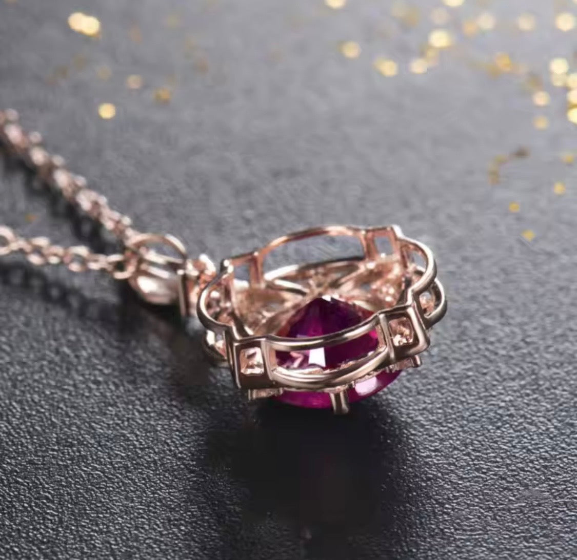14K rose gold ruby diamond pendant with round natural ruby and floral halo design