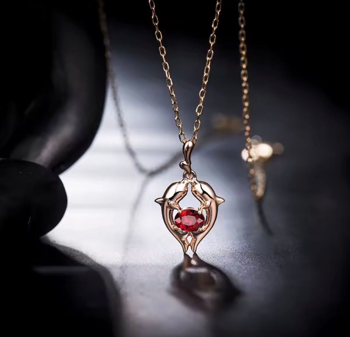 18K rose gold ruby pendant with Pisces zodiac dolphin design and 0.33 carat gemstone