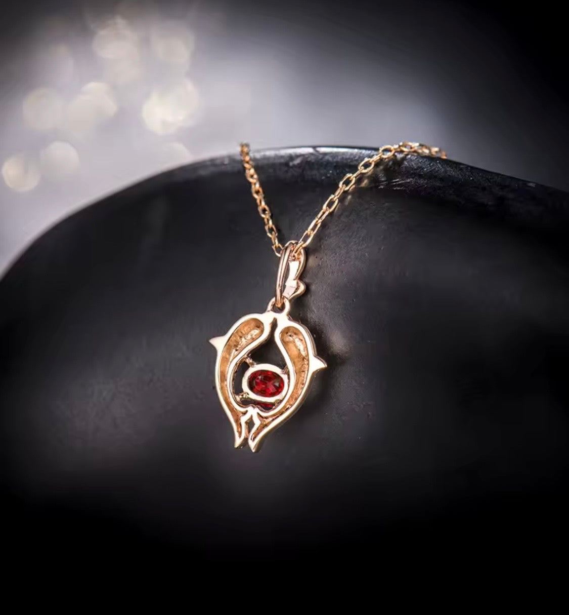 18K rose gold ruby pendant with Pisces zodiac dolphin design and 0.33 carat gemstone