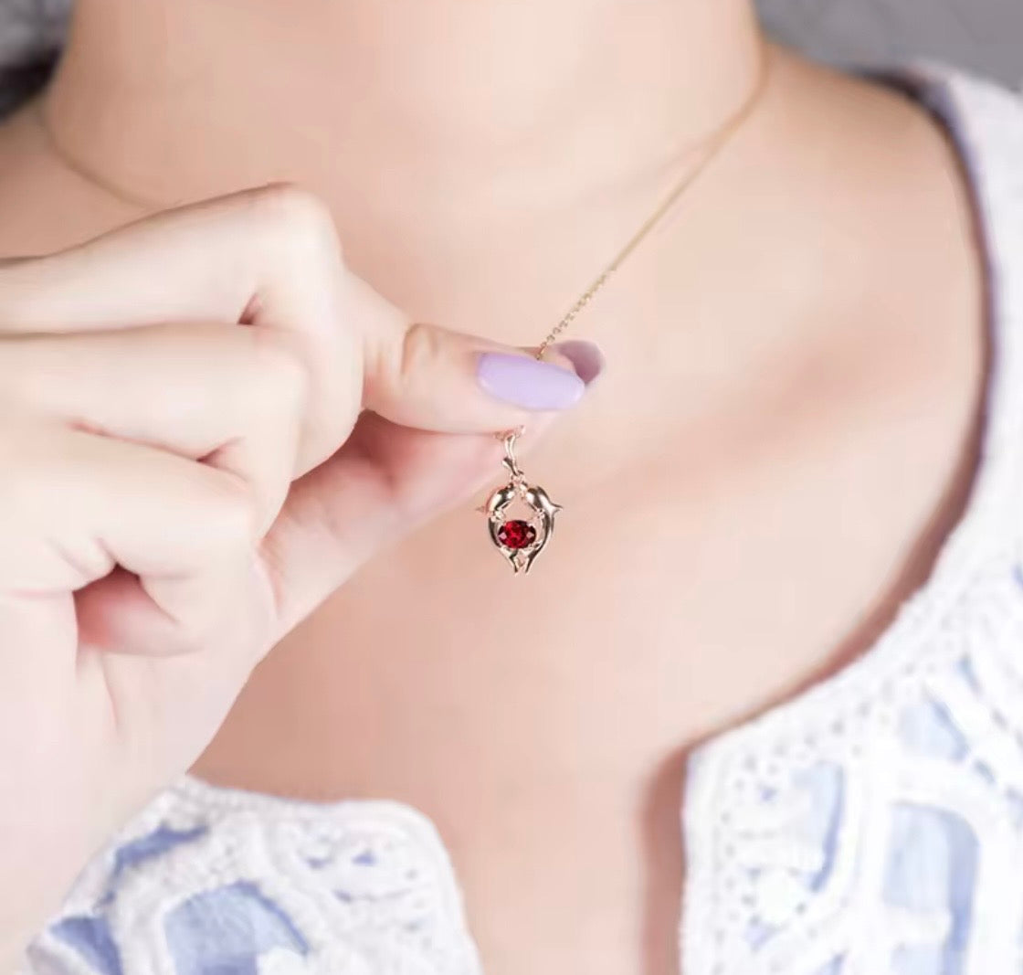 18K rose gold ruby pendant with Pisces zodiac dolphin design and 0.33 carat gemstone