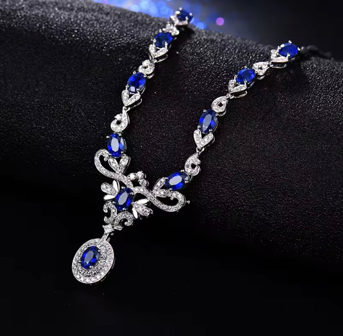 18K gold sapphire diamond necklace with 5.68 carat natural sapphires and cascading elegant design