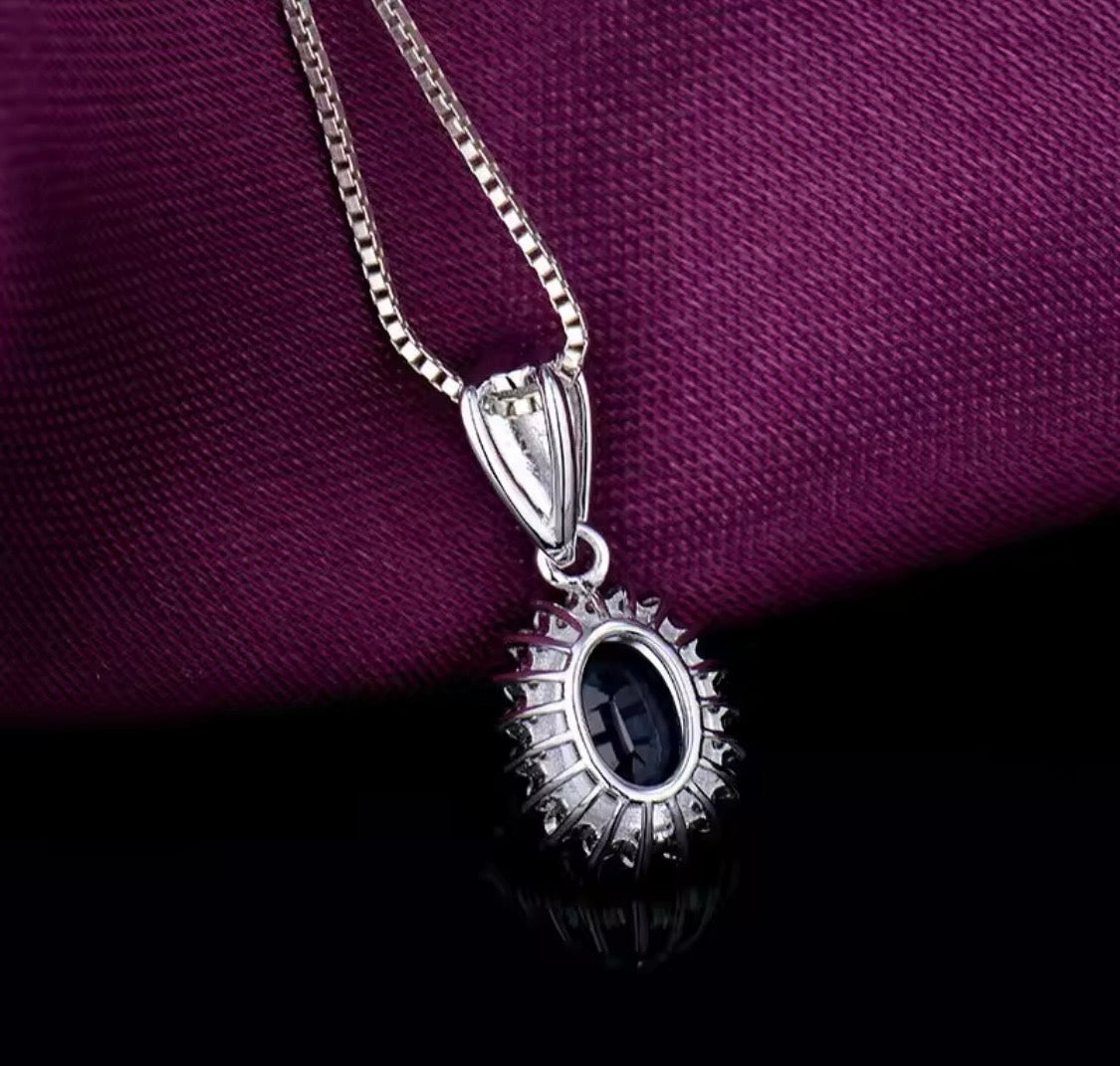18K white gold sapphire diamond pendant with 1.60 carat oval natural sapphire and diamond halo