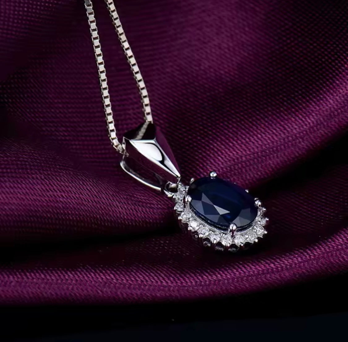 18K white gold sapphire diamond pendant with 1.60 carat oval natural sapphire and diamond halo