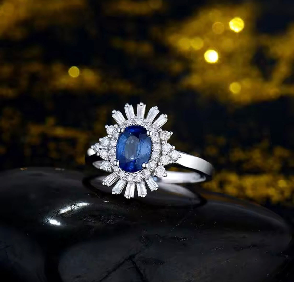 18K white gold sapphire diamond ring with oval natural sapphire and sunburst halo baguette diamonds