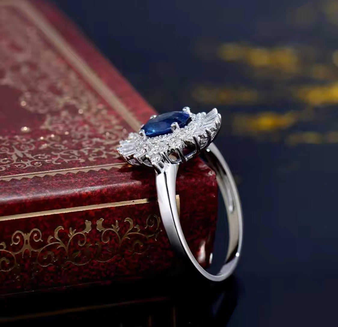 18K white gold sapphire diamond ring with oval natural sapphire and sunburst halo baguette diamonds