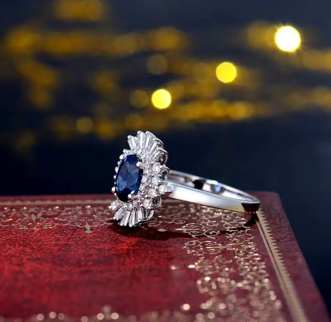 18K white gold sapphire diamond ring with oval natural sapphire and sunburst halo baguette diamonds
