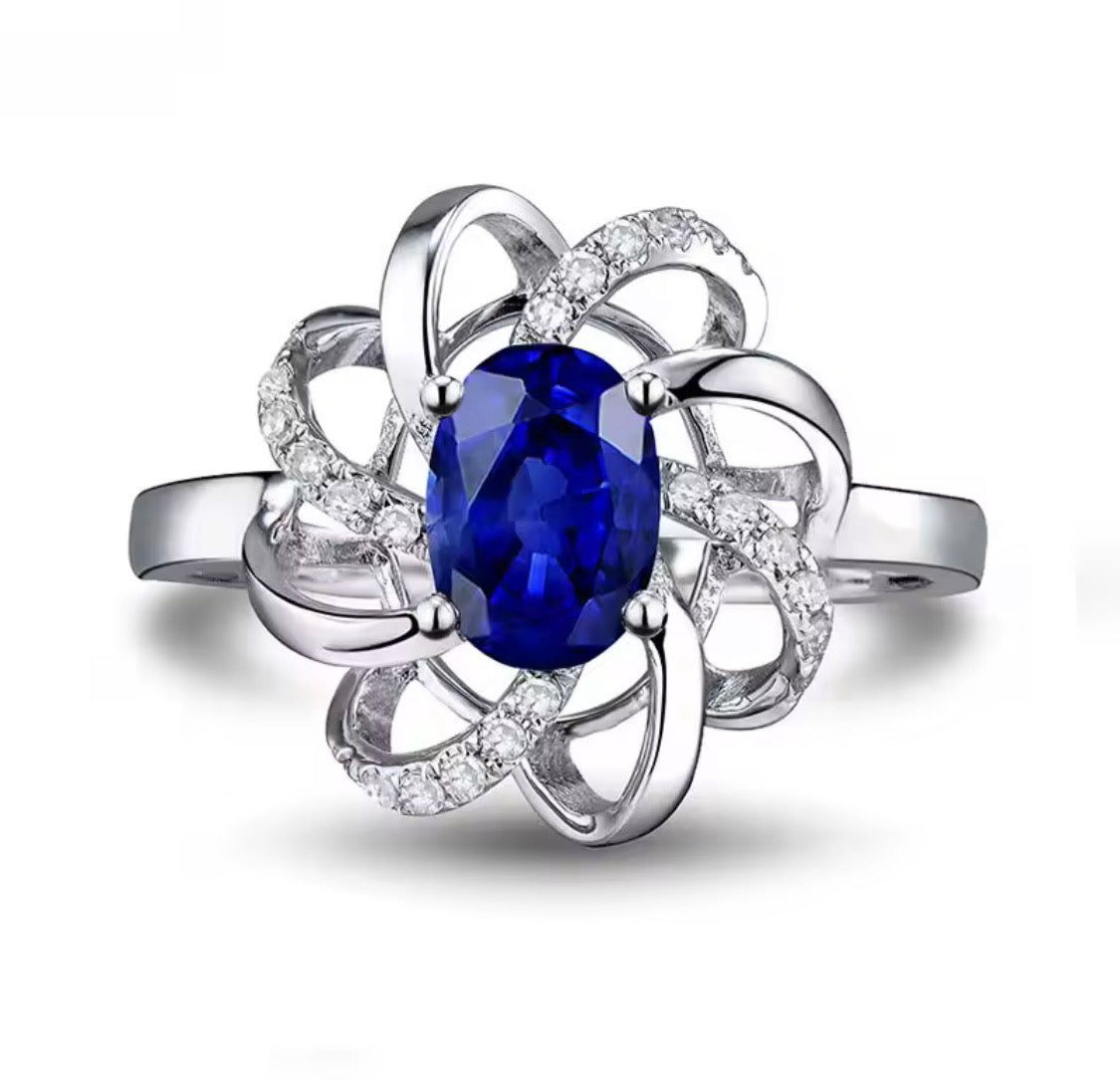 18K white gold sapphire diamond ring with oval natural sapphire and intertwined halo design