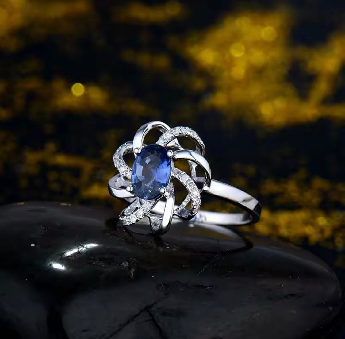 18K white gold sapphire diamond ring with oval natural sapphire and intertwined halo design