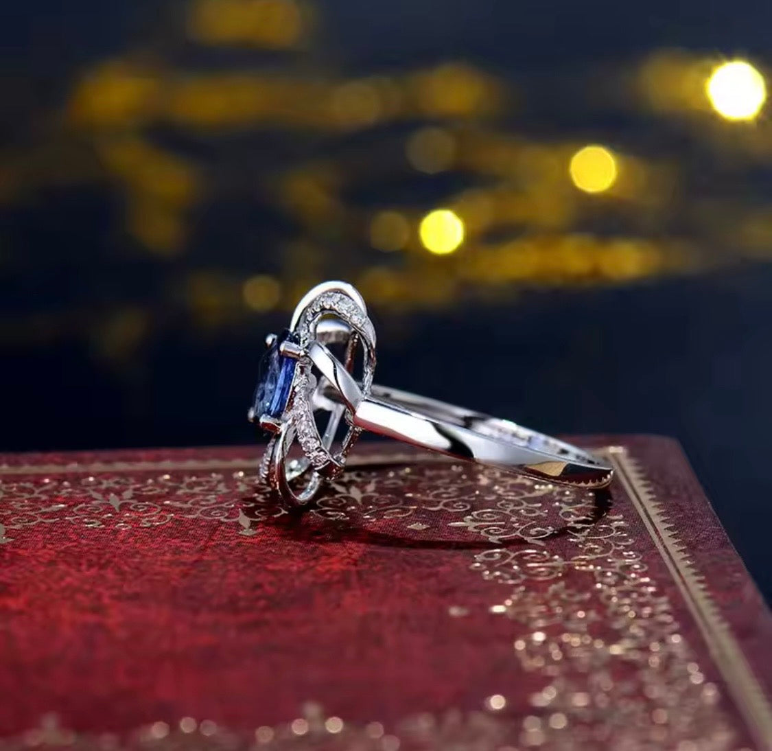 18K white gold sapphire diamond ring with oval natural sapphire and intertwined halo design