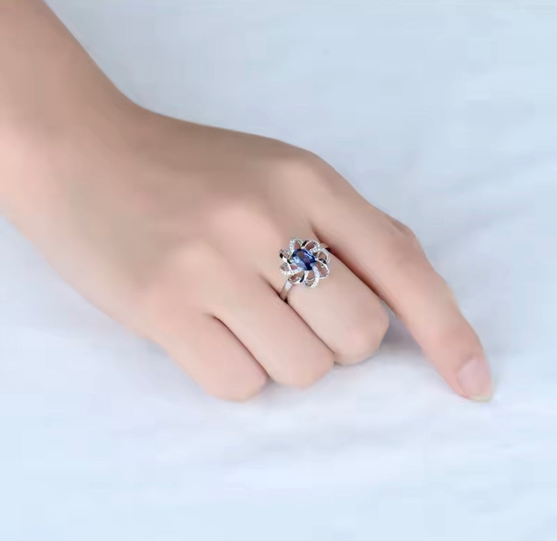 18K white gold sapphire diamond ring with oval natural sapphire and intertwined halo design