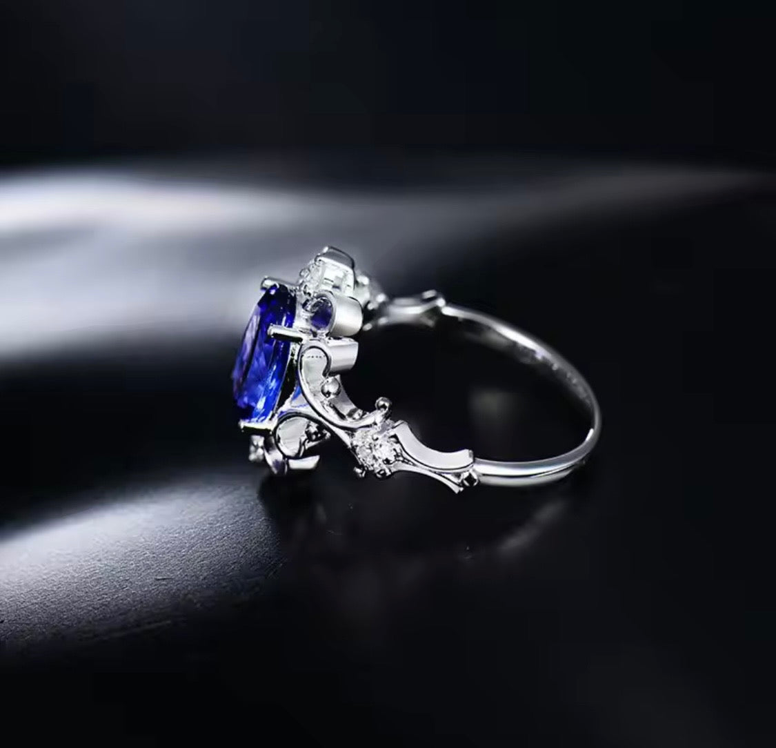 14K white gold tanzanite diamond ring with 1.70 carat oval natural tanzanite princess style design