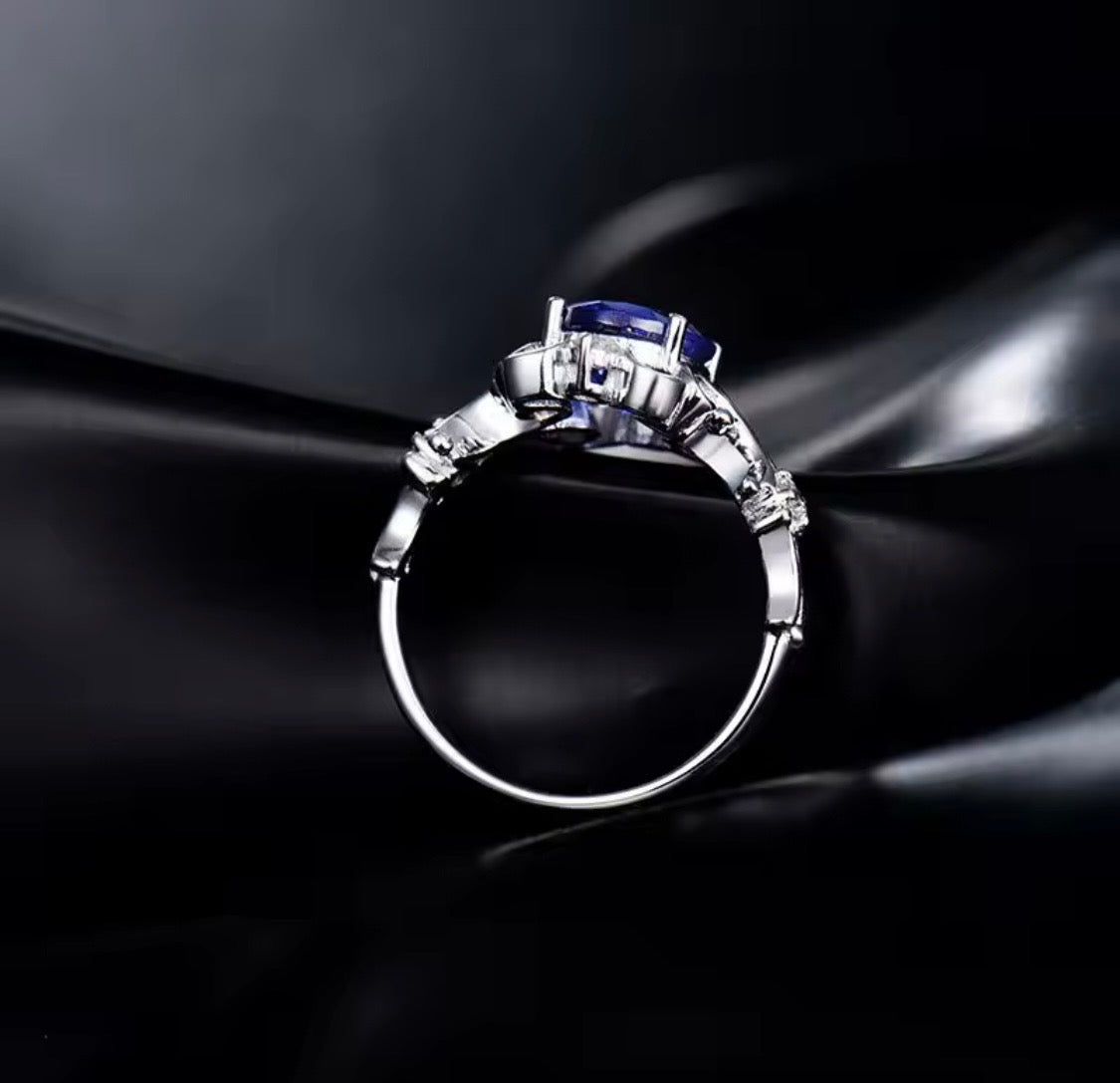 14K white gold tanzanite diamond ring with 1.70 carat oval natural tanzanite princess style design