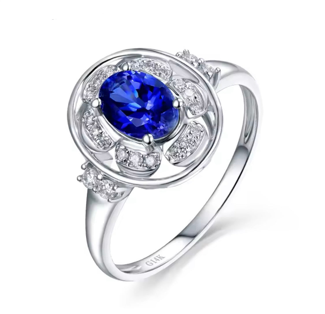 14K white gold tanzanite diamond ring with natural oval tanzanite and diamond halo design