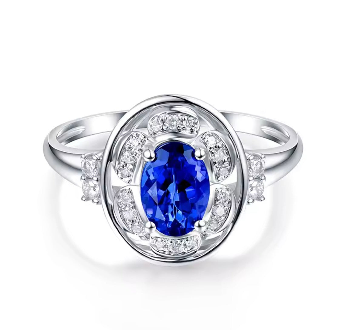 14K white gold tanzanite diamond ring with natural oval tanzanite and diamond halo design