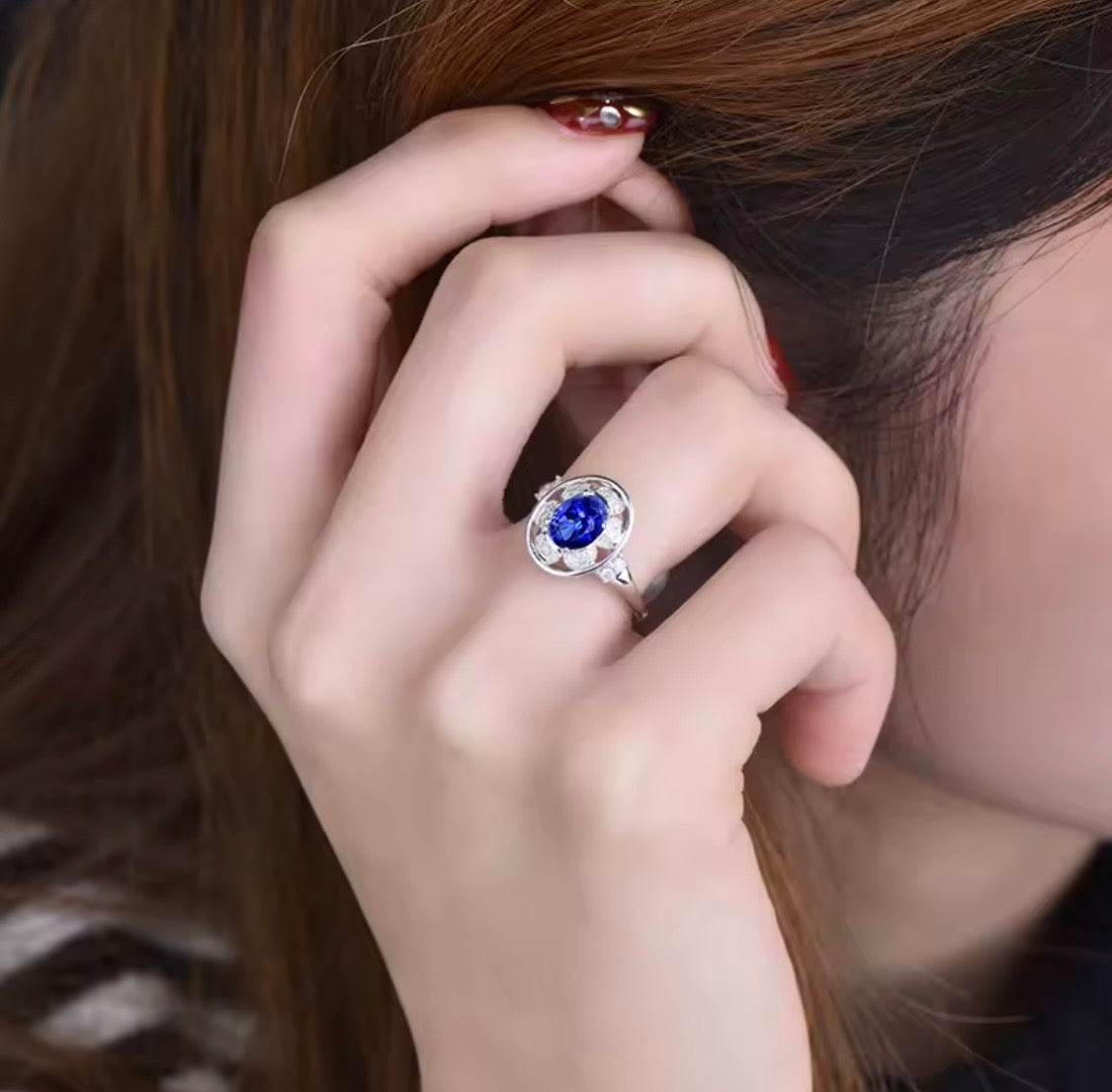 14K white gold tanzanite diamond ring with natural oval tanzanite and diamond halo design