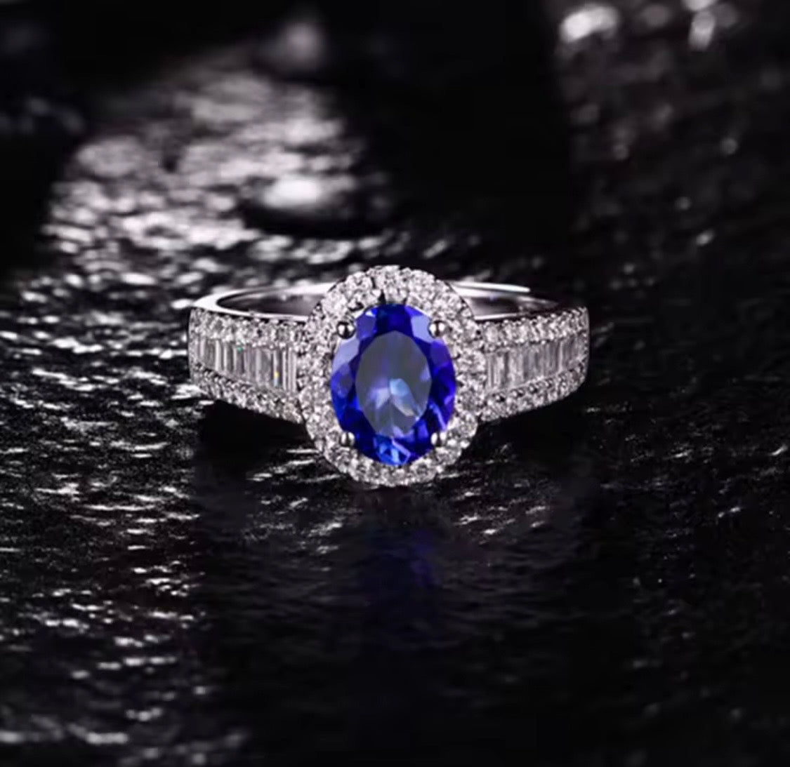 18K gold tanzanite engagement ring with 1.18 carat oval natural tanzanite and diamond halo available in white rose and yellow gold