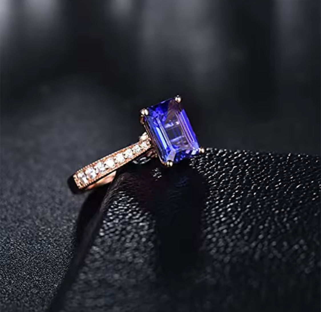 14K rose gold tanzanite engagement ring with natural emerald cut tanzanite and diamond band