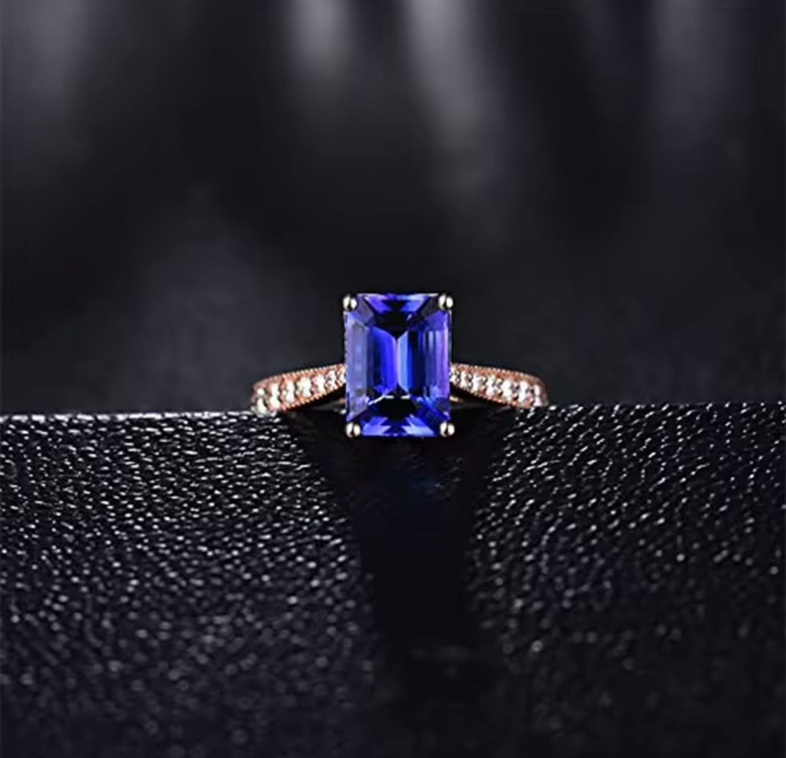 14K rose gold tanzanite engagement ring with natural emerald cut tanzanite and diamond band