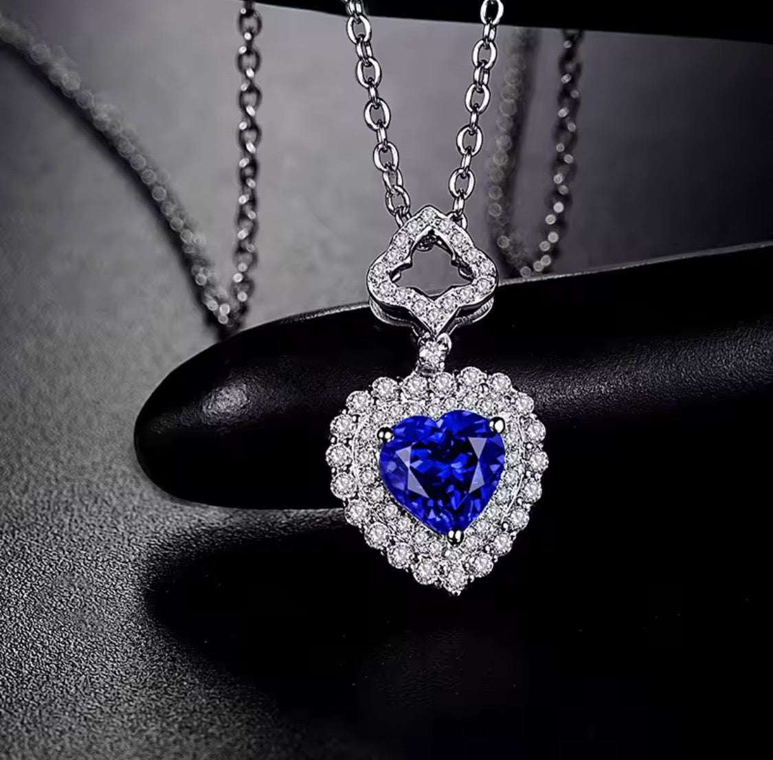 14K gold tanzanite heart pendant with 1.63 carat gemstone and diamond halo