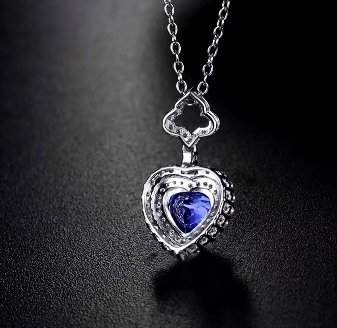 14K gold tanzanite heart pendant with 1.63 carat gemstone and diamond halo