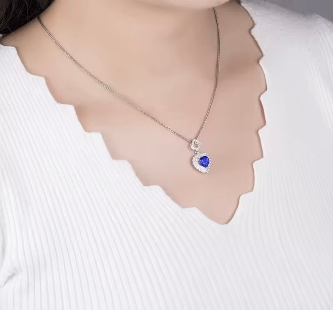 14K gold tanzanite heart pendant with 1.63 carat gemstone and diamond halo