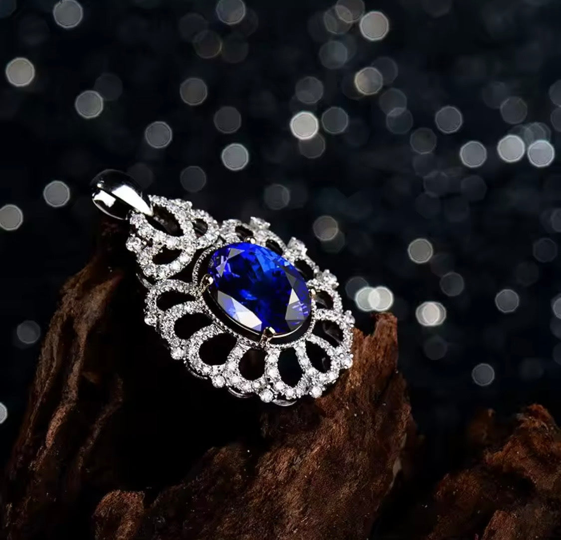 14K gold tanzanite pendant with 4.22 carat oval gemstone and diamond halo design