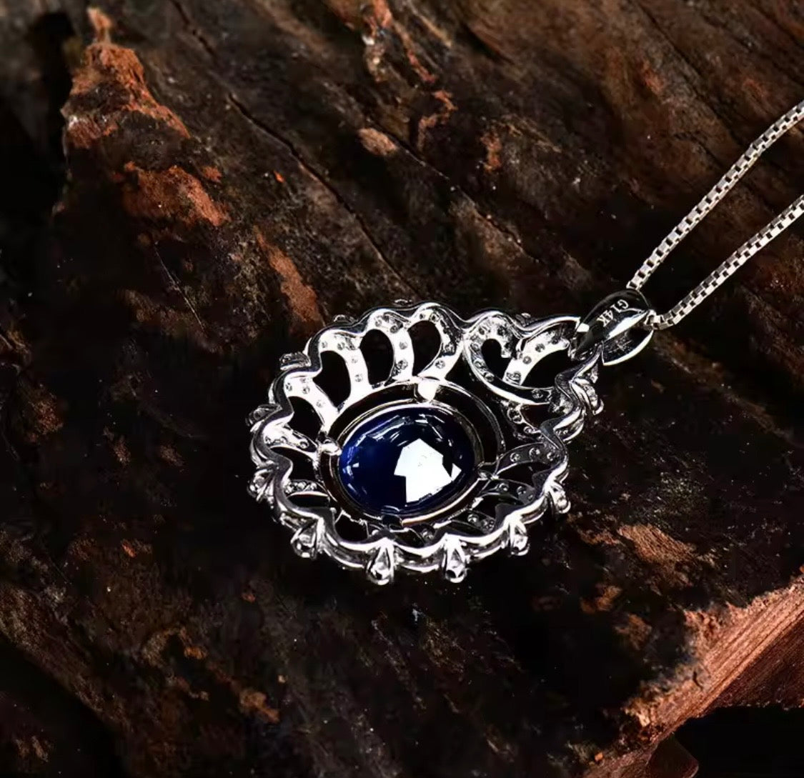 14K gold tanzanite pendant with 4.22 carat oval gemstone and diamond halo design