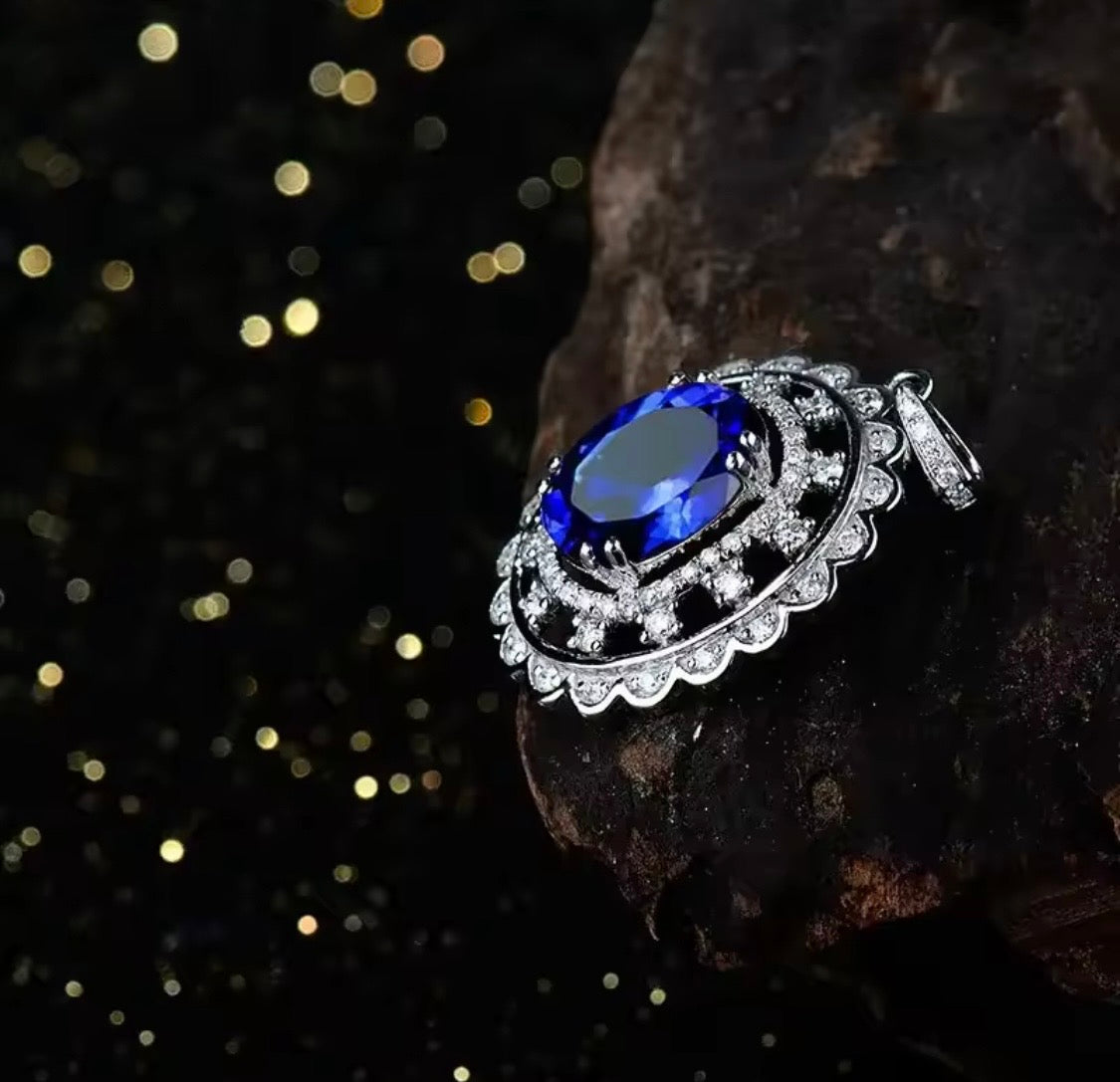 14K gold tanzanite pendant with 4.2 carat oval gemstone and diamond halo design