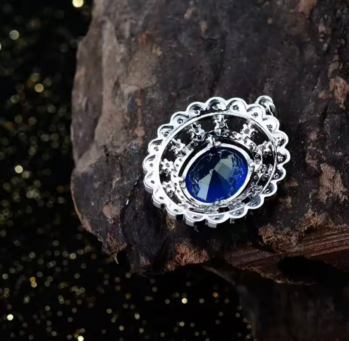 14K gold tanzanite pendant with 4.2 carat oval gemstone and diamond halo design