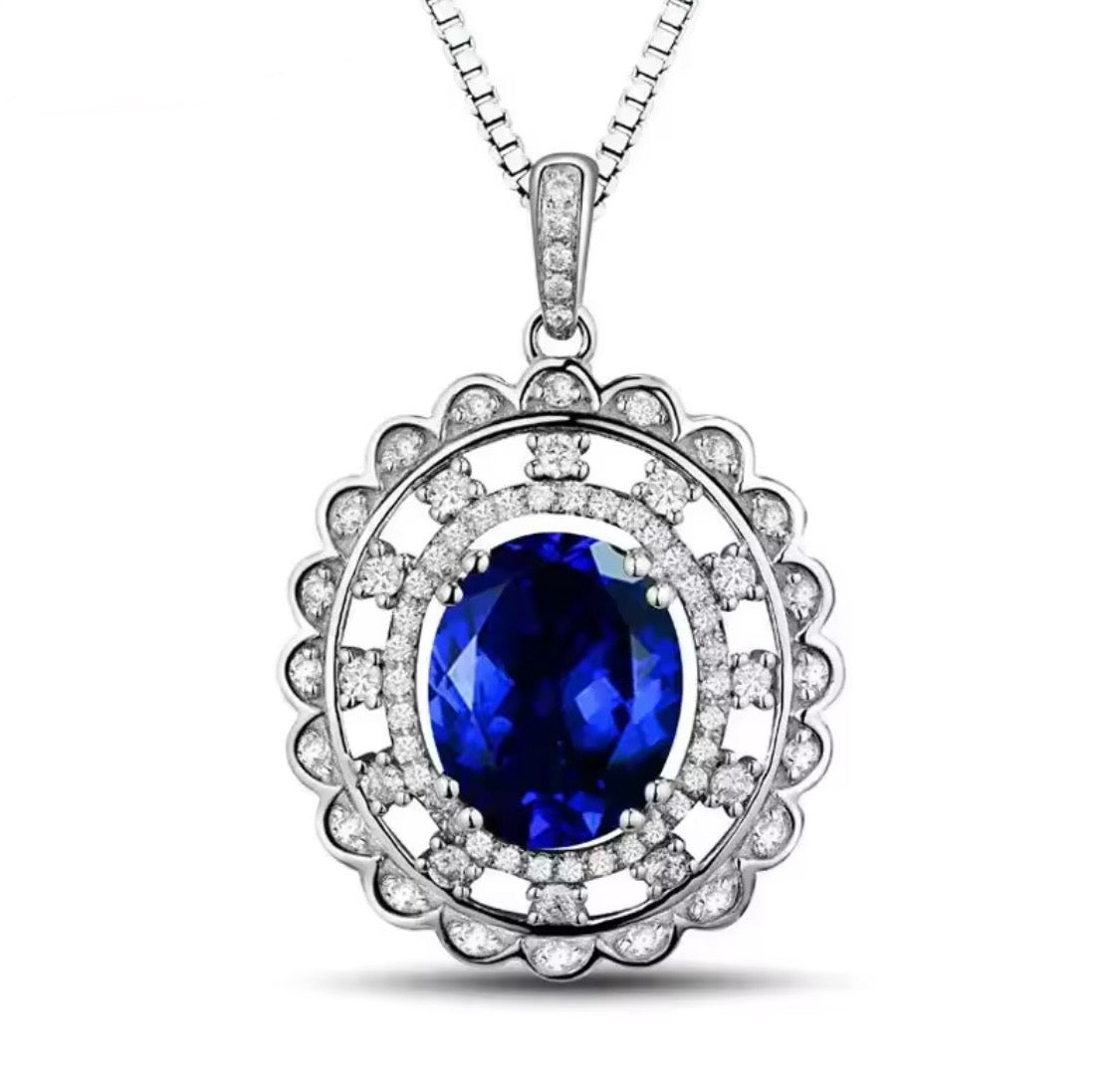 14K gold tanzanite pendant with 4.2 carat oval gemstone and diamond halo design