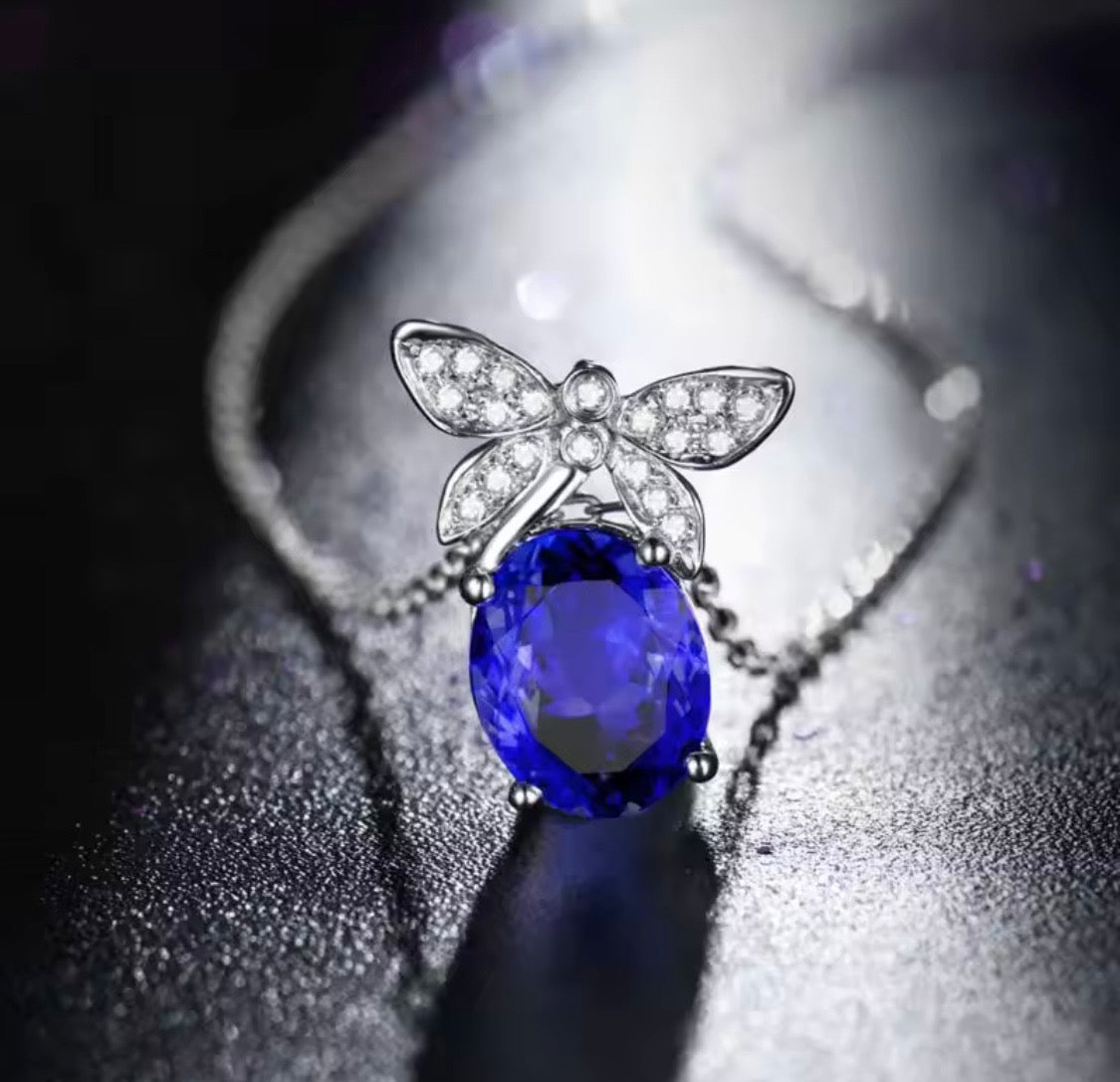 18K gold tanzanite pendant with 2.51 carat oval gemstone and diamond butterfly design