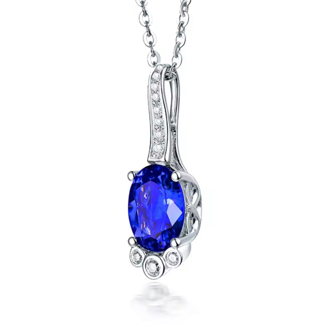 18K gold tanzanite pendant with oval 7x9mm gemstone and diamond drop design
