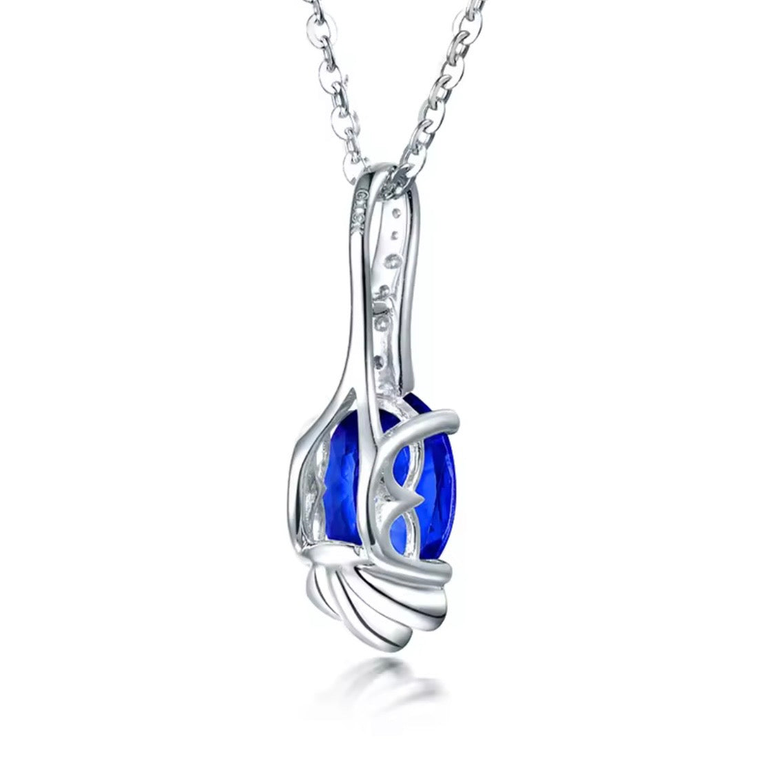 18K gold tanzanite pendant with oval 7x9mm gemstone and diamond drop design