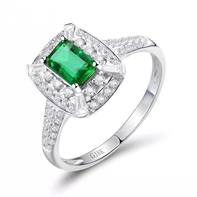0.65 ct natural emerald and 0.50 ct diamond halo ring in 18K white gold