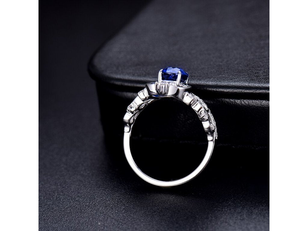 18Kt White Gold 0.80ct Sapphire Ring with Natural Diamonds