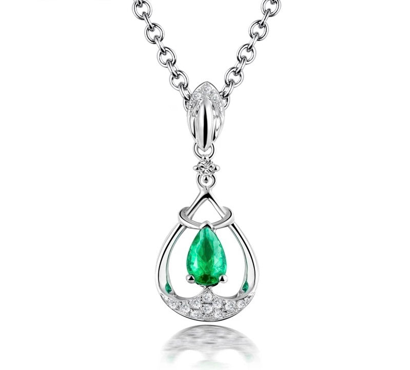 Přívěsek ze 18kt bílého zlata s 0,28 ct smaragdem 